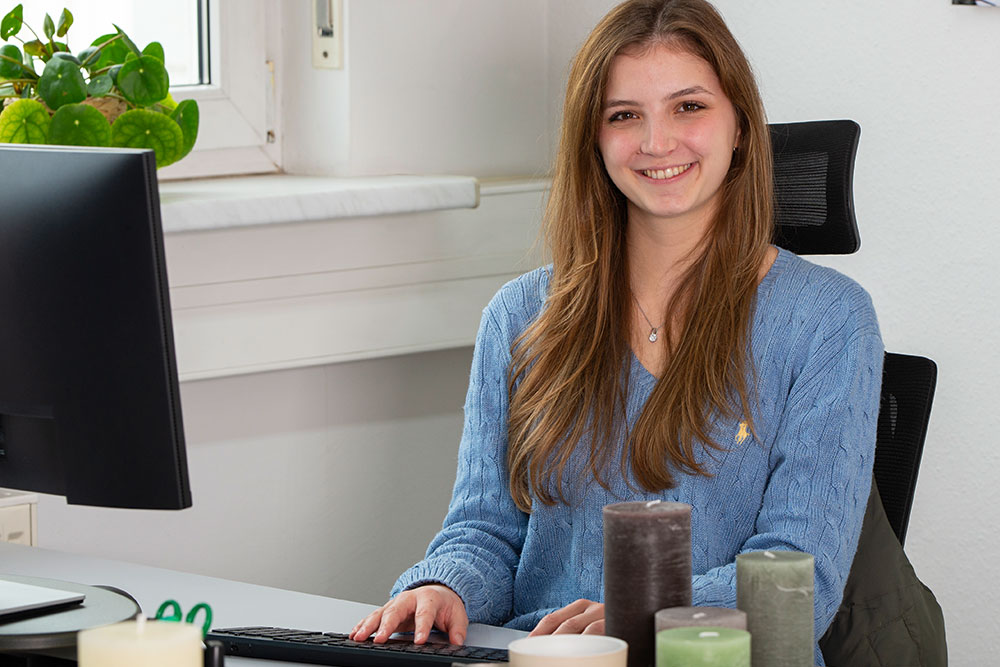 Trainee at her workplace in the office