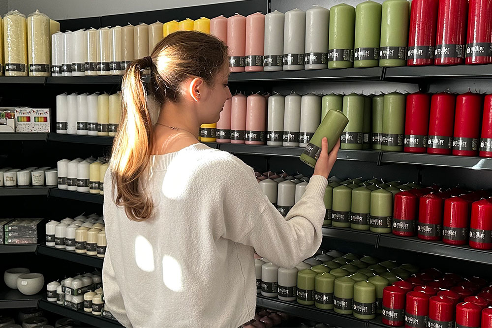 Müller candle brand at the point of sale