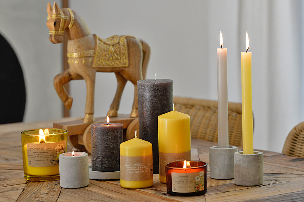 Decorative candle arrangement in warm yellow and earthy tones