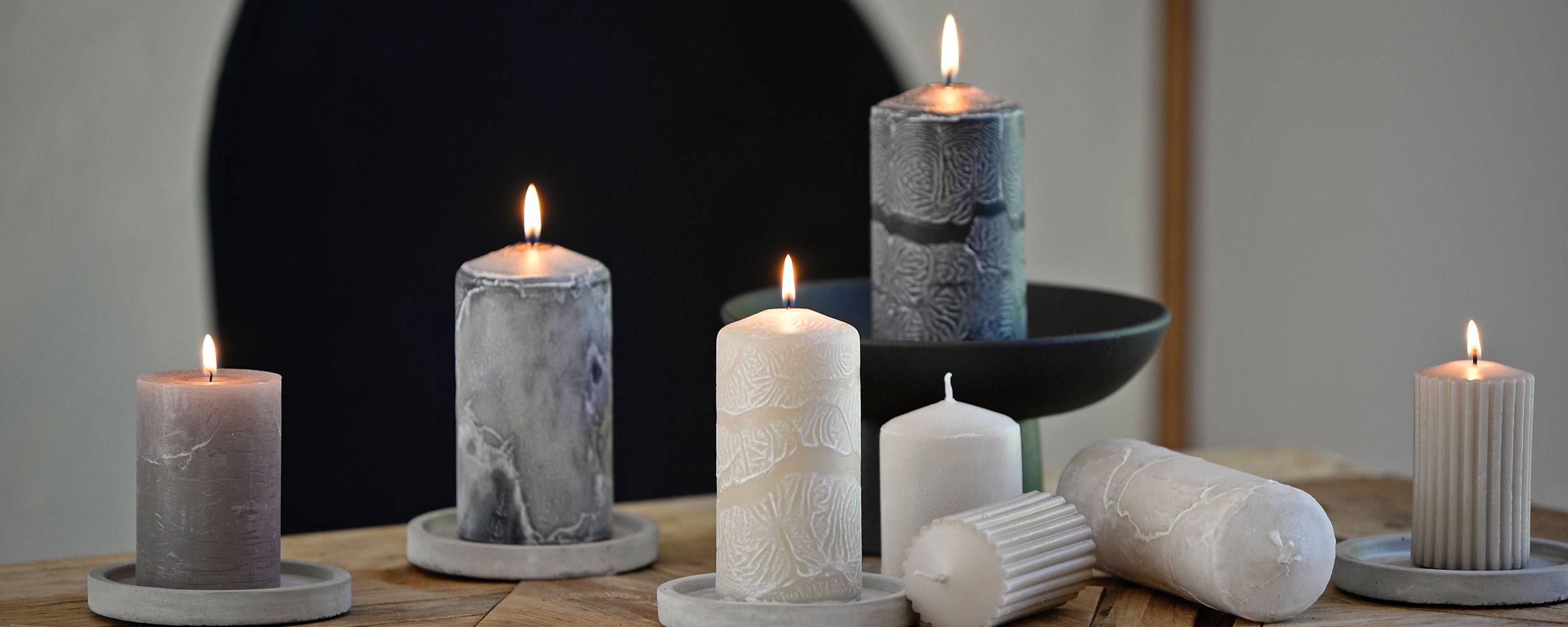 Decorative pillar candles with textured surfaces